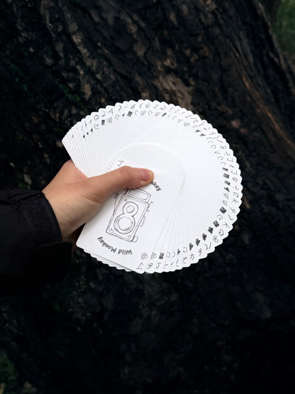 Wild Monkey Playing Cards displayed in a hand fan